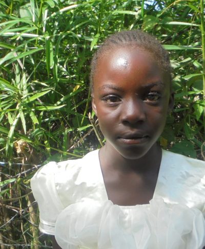 Click Lynne's picture to sponsor her - She is 11 years old, loves reading and wants to be a doctor.