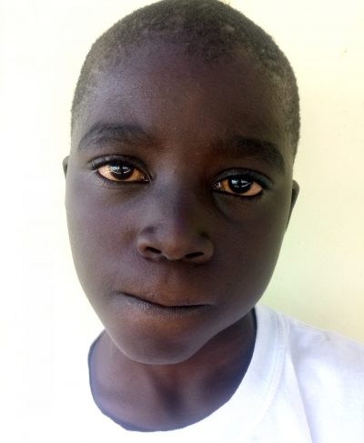 Click Enock's picture to sponsor him - He is 9 years old, loves coloring, and wants to be a doctor.