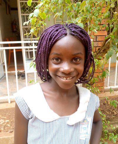 Click Claire's picture to sponsor her - She is 9 years old, loves singing, and wants to be a doctor.