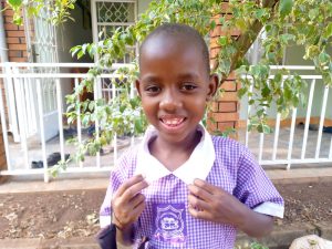 Click Edith's picture to sponsor her - She is 7 years old, loves reading, and wants to be a Doctor.