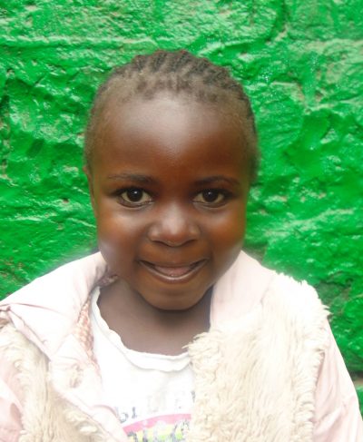 Click Irine's picture to sponsor her - She is 7 years old, enjoys learning Kiswahili and hopes to be a teacher.