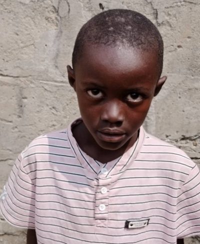 Click Jordi's picture to sponsor him - He is 9 years old, likes writing and wants to be a mason.