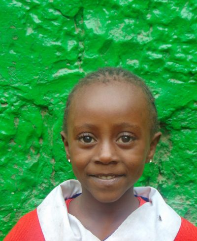 Click Talia's picture to sponsor her - She is 5 years old, enjoys playing games and hopes to be a doctor.