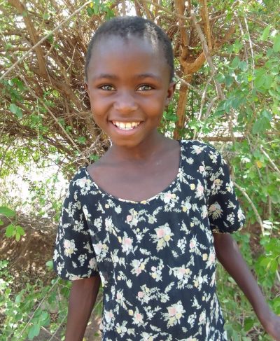 Click Esther's picture to sponsor her - She is 6 years old, loves counting, and wants to be a teacher.