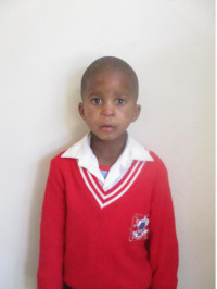 Click Thabang's picture to sponsor him - He is 8 years old, enjoys learning to write, and wants to be a policeman.