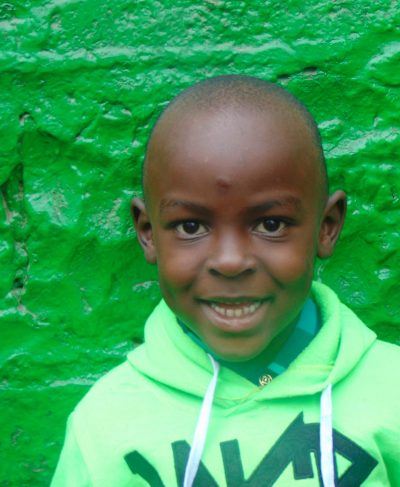 Click Brighton's picture to sponsor him - He is 7 years old, enjoys drawing and hopes to be a policeman.