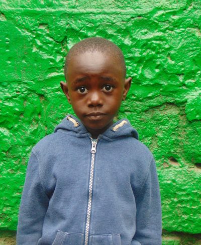 Click Samuel's picture to sponsor him - He is 8 years old, enjoys numbers and hopes to be a driver.