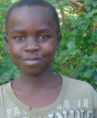 Click Martine's picture to sponsor him - He is 8 years old, enjoys learning math and hopes to be a driver.
