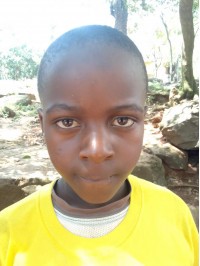 Click Rodges' picture to sponsor him - He is 8 years old, enjoys learning math and hopes to be a mechanic.